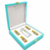 luxury-perfume-gift-box-turquoise-mandakani Turquoise luxury perfume gift box with premium fragrance bottles